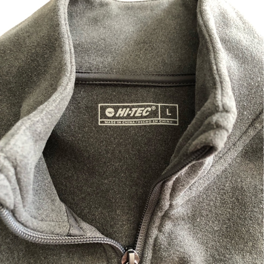 Gray zip-up jacket with pockets. Soft feel. Material is polyester and spandex. - Picture 3 of 4